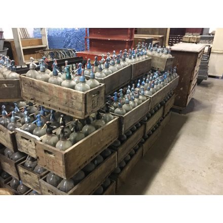 Antique soda bottles in old wooden crates